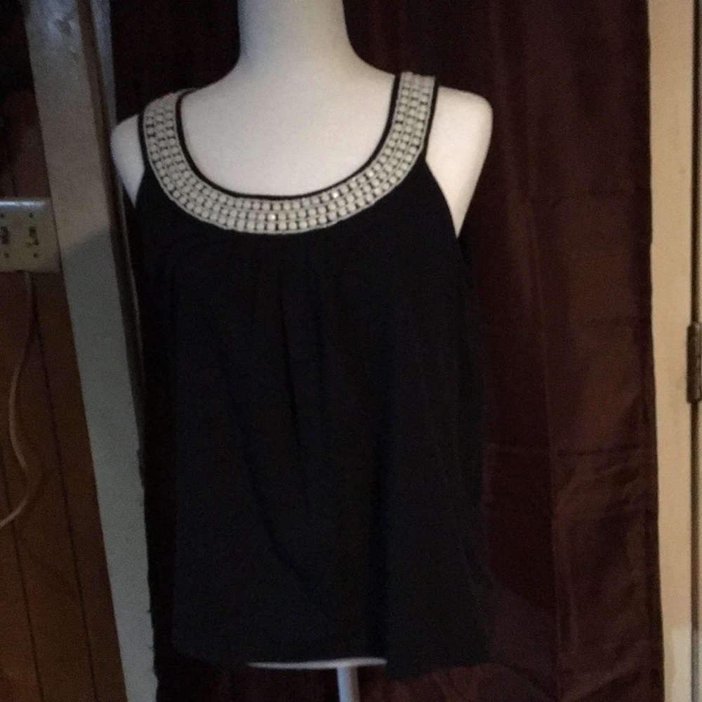 Top with beads. Fits like medium